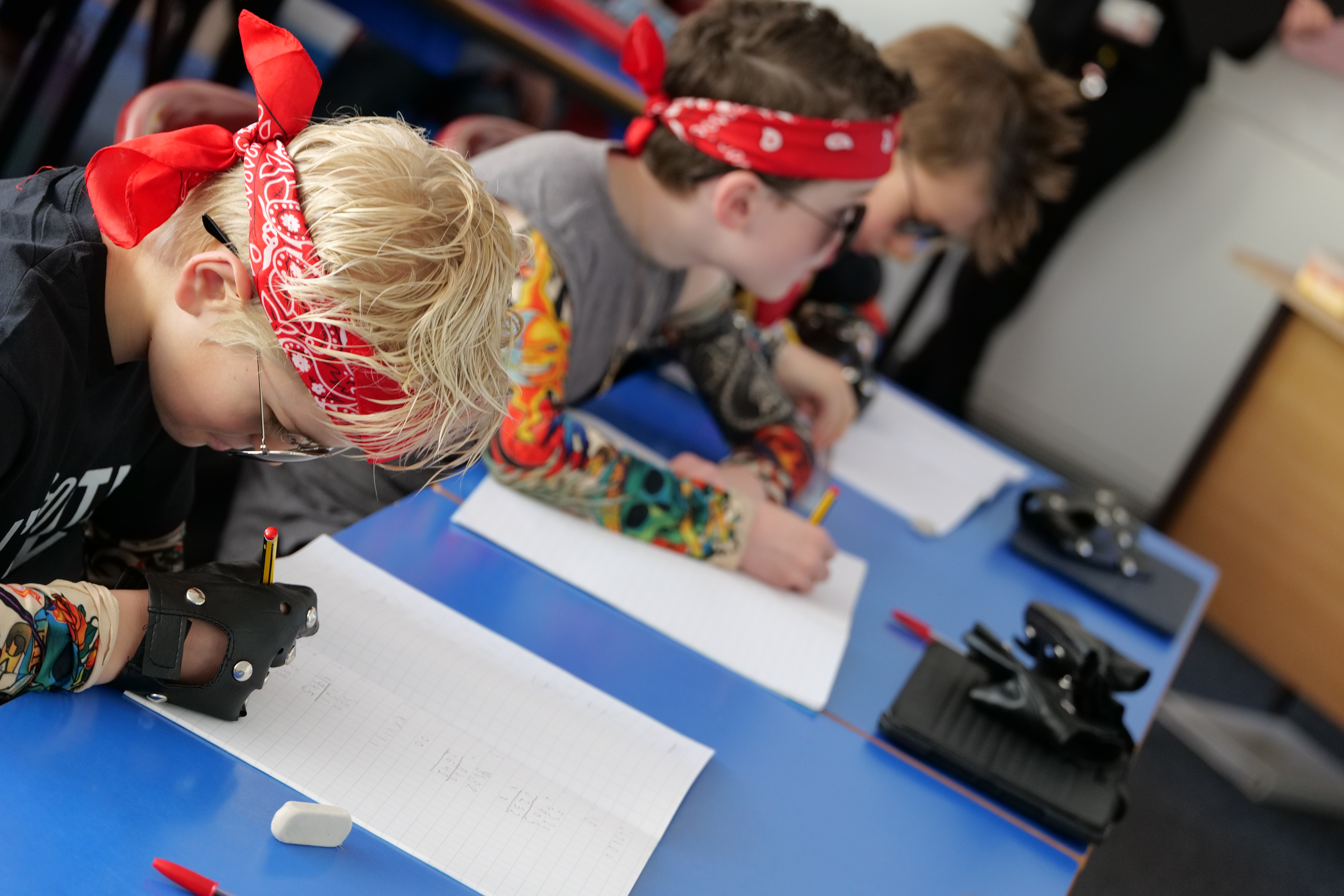 Students doing maths while dressed as rockstars