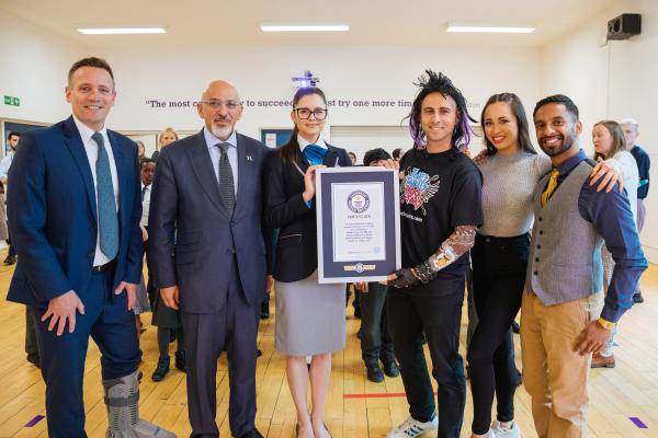 Guinness World Record certificate being handed over